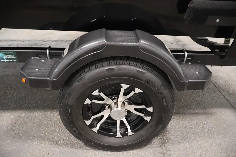 Slide: The Image of 2022 Lowe Fishing Machine 1625WT trailer wheel with black fender and step. - 42