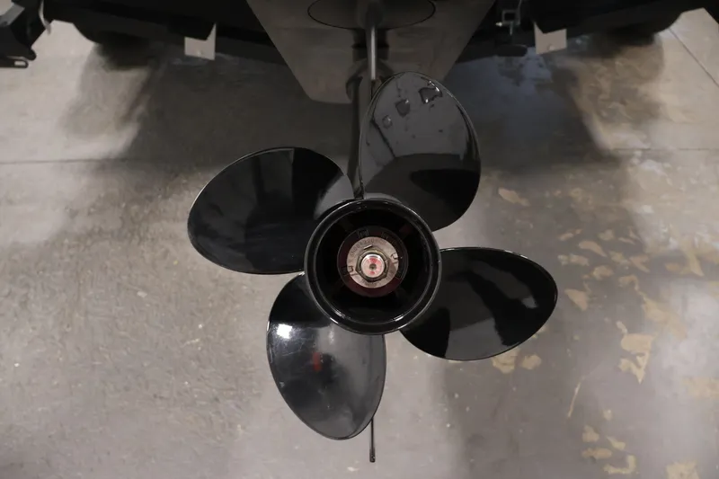 Slide: The Image of Propeller of 2022 Lowe Fishing Machine 1625WT boat on concrete floor. - 39