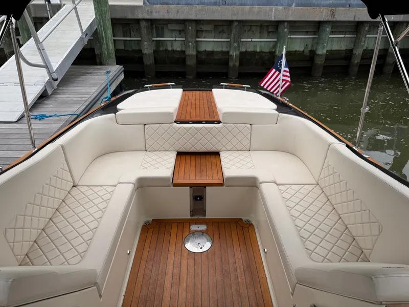 Slide: The Image of The image shows the cockpit of a 2020 Chris-Craft Corsair 34 with elegant cream-colored upholstery. - 36
