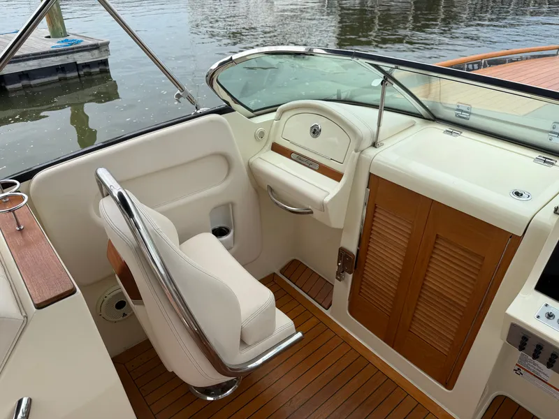 Slide: The Image of The image shows the cockpit of a 2020 Chris-Craft Corsair 34 with elegant wood accents. - 28