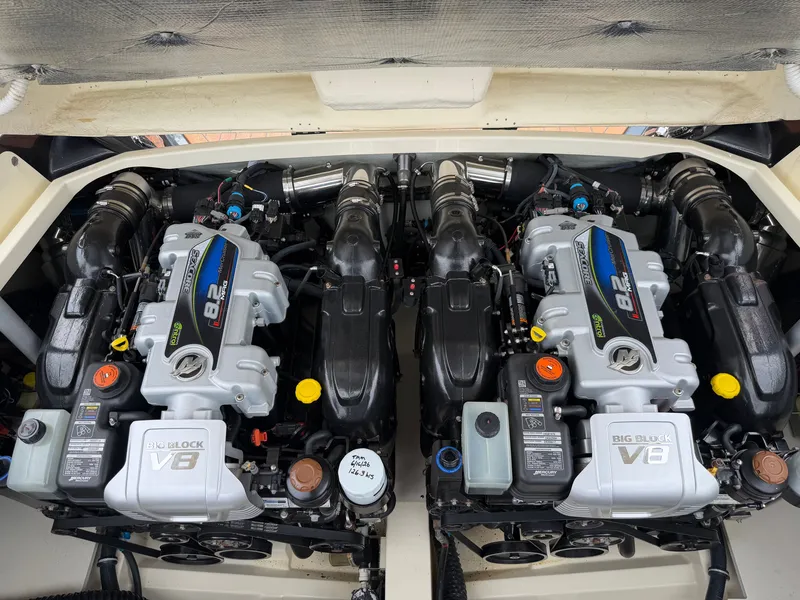 Slide: The Image of Two powerful V8 engines in the engine compartment of a 2020 Chris-Craft Corsair 34 boat. - 49