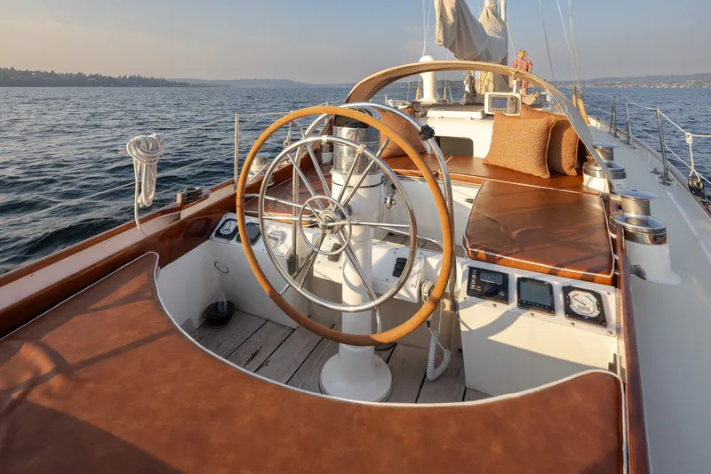 Slide: The Image of Cockpit of a 1970 Sparkman & Stephens 57 yacht with wooden wheel and leather seating. - 25
