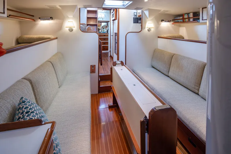 Slide: The Image of Interior of a 1970 Sparkman & Stephens 57 yacht with cozy seating and wooden flooring. - 3