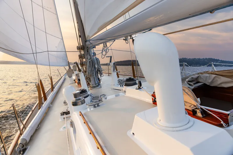 Slide: The Image of Sailing on a 1970 Sparkman & Stephens 57 yacht at sunset, with open sails. - 21