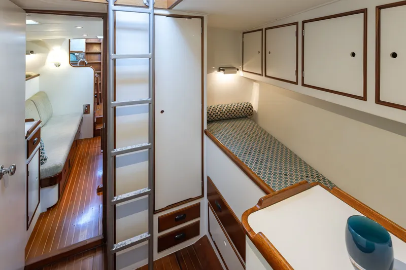 Slide: The Image of Interior of 1970 Sparkman & Stephens 57 yacht with cozy bunks and wooden flooring. - 14