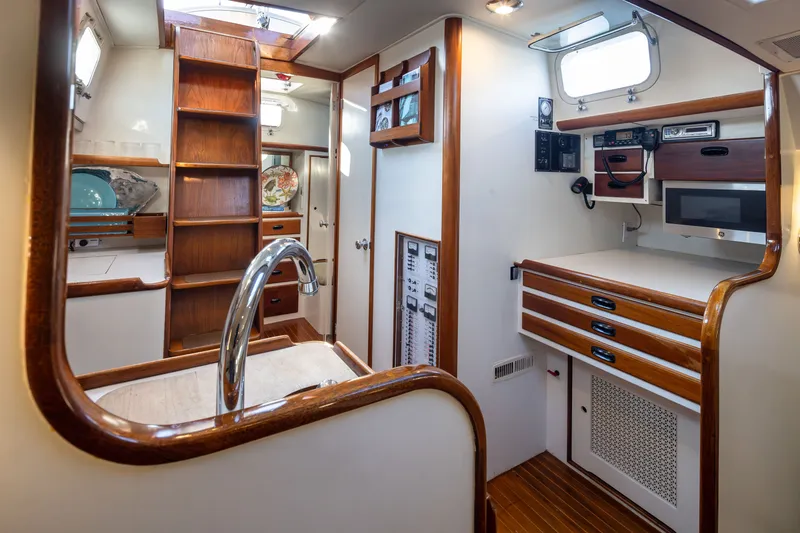 Slide: The Image of Interior of a 1970 Sparkman & Stephens 57 yacht with wood accents and modern amenities. - 6