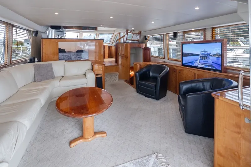 Slide: The Image of Luxurious 2004 Navigator Pilothouse yacht interior with leather seating and large windows. - 8