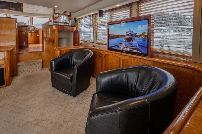 Slide: The Image of Luxurious 2004 Navigator Pilothouse interior with leather chairs and large windows. - 12
