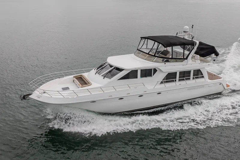 Slide: The Image of 2004 Navigator Pilothouse yacht cruising on open water. - 1