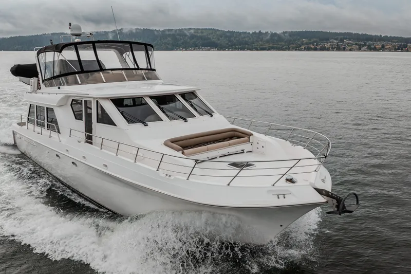 Slide: The Image of 2004 Navigator Pilothouse yacht cruising on a scenic lake. - 49