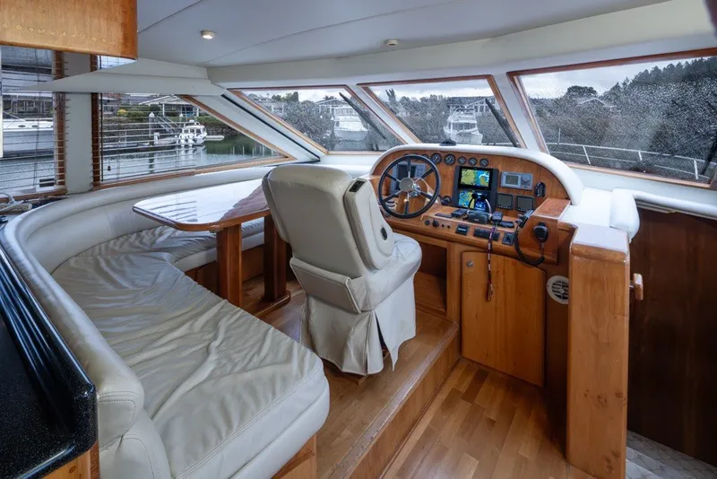 Slide: The Image of Luxurious 2004 Navigator Pilothouse interior with helm, seating, and panoramic windows. - 17