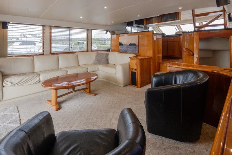 Slide: The Image of Luxurious 2004 Navigator Pilothouse yacht interior with leather seating and wooden accents. - 11