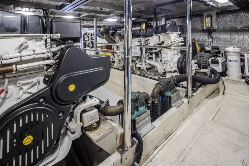Slide: The Image of Engine room of a 2004 Navigator Pilothouse yacht, showcasing mechanical components and equipment. - 41