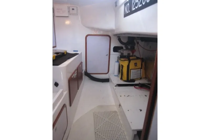 Slide: The Image of Interior of a 2014 Outbound 46 sailboat, featuring storage and equipment areas. - 23