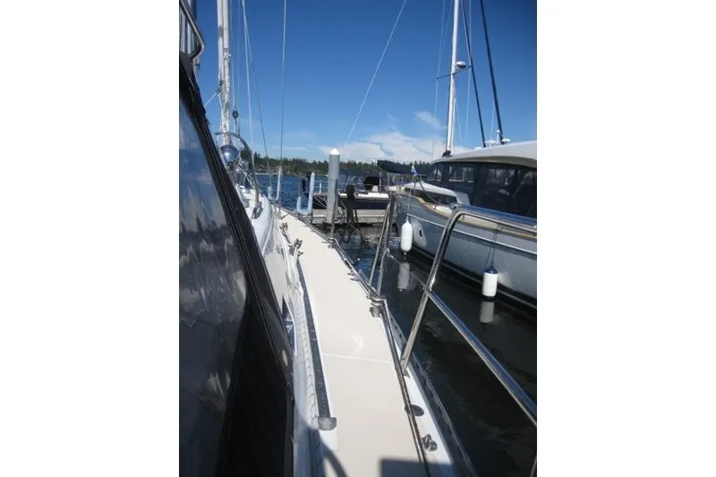 Slide: The Image of Sailboat docked at marina, Outbound 46 model, 2014, sunny day, calm waters. - 37