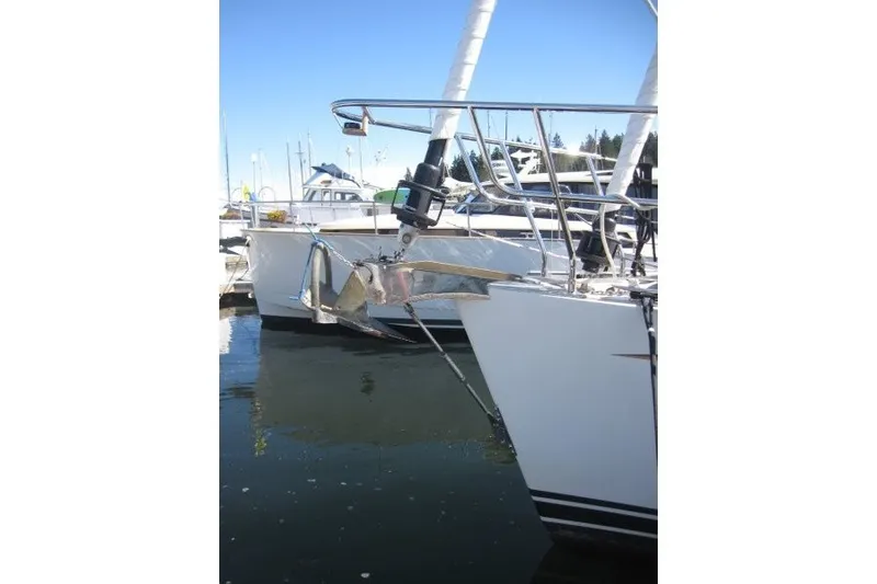 Slide: The Image of Sailboat bow with anchor, Outbound 46 model, 2014, docked in marina. - 49