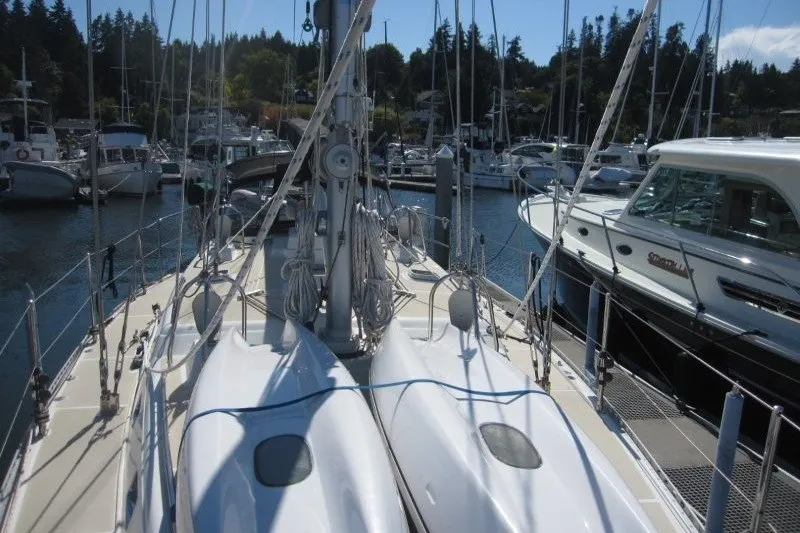 Slide: The Image of Sailboat docked in marina, Outbound 46 model, 2014, surrounded by other boats. - 41