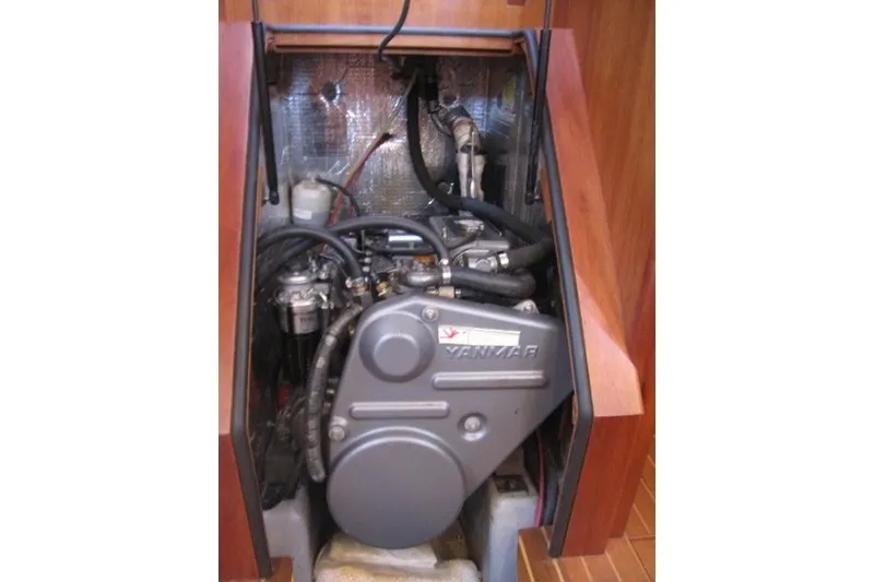 Slide: The Image of Engine compartment of a 2014 Outbound 46 sailboat, featuring a Yanmar engine. - 24