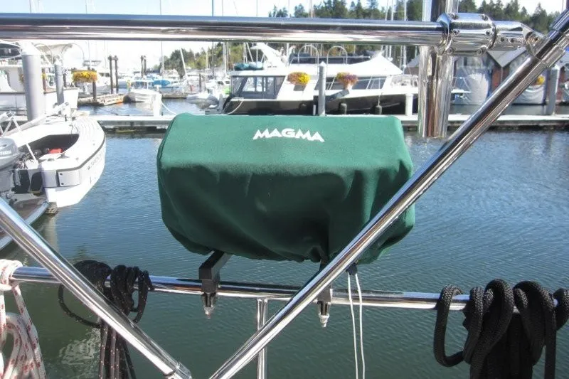 Slide: The Image of Green Magma grill cover on Outbound 46 yacht, docked at marina, 2014. - 32