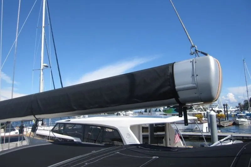 Slide: The Image of Outbound 46 sailboat from 2014 docked at a marina under clear blue skies. - 46