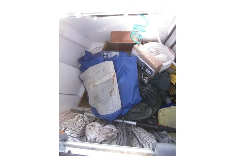 Slide: The Image of Storage compartment of 2014 Outbound 46 sailboat with ropes and gear. - 40