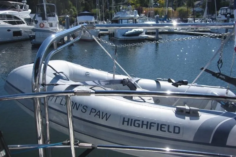 Slide: The Image of Inflatable boat "Highfield" docked at marina, surrounded by yachts, Outbound 46, 2014 model. - 30