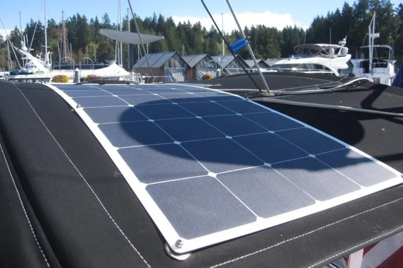 Slide: The Image of Solar panel on 2014 Outbound 46 yacht, docked at marina with forest backdrop. - 47