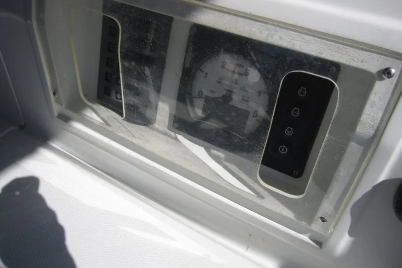 Slide: The Image of Instrument panel of a 2014 Outbound 46 yacht, featuring gauges and controls. - 31