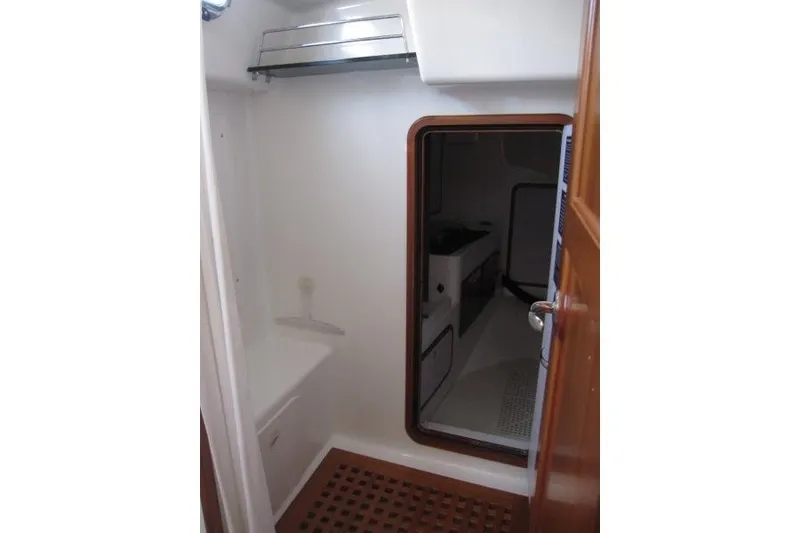 Slide: The Image of Interior view of 2014 Outbound 46 yacht, featuring a compact cabin space. - 18