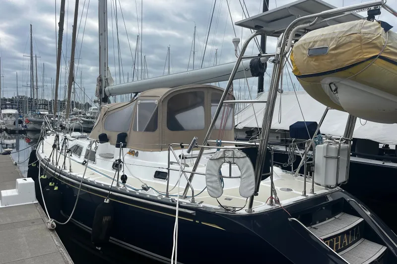 Slide: The Image of Sailboat docked at marina, Hylas 49 model, 1994, with overcast sky. - 32