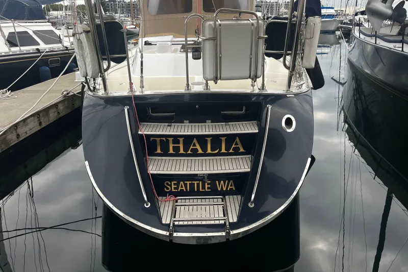 Slide: The Image of Hylas 49 sailboat named "Thalia" docked in Seattle marina, 1994 model. - 37