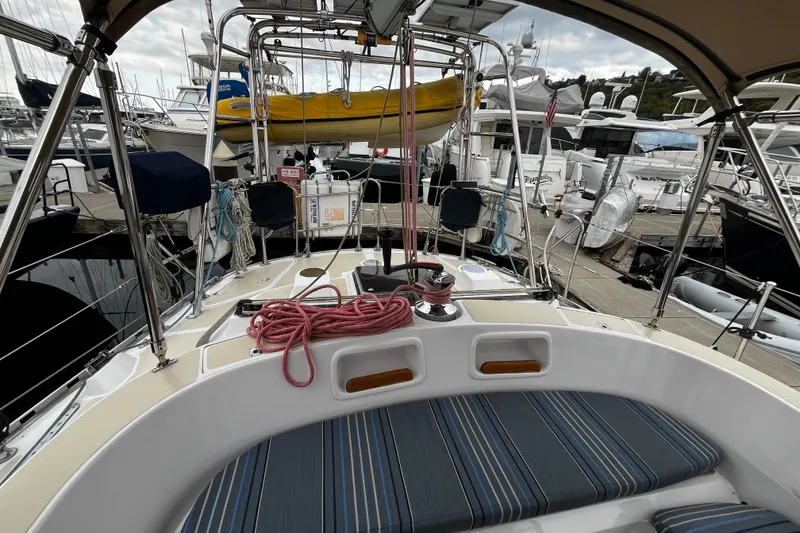 Slide: The Image of Cockpit view of a 1994 Hylas 49 sailboat docked at a marina. - 52
