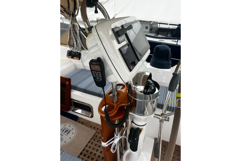 Slide: The Image of Cockpit of 1994 Hylas 49 sailboat with navigation equipment and seating. - 49
