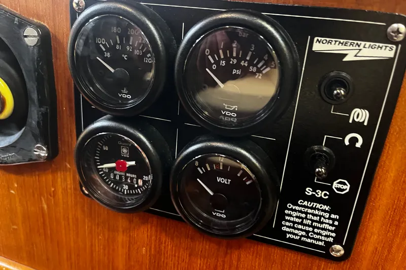 Slide: The Image of Control panel of a 1994 Hylas 49 yacht with gauges and switches. - 28
