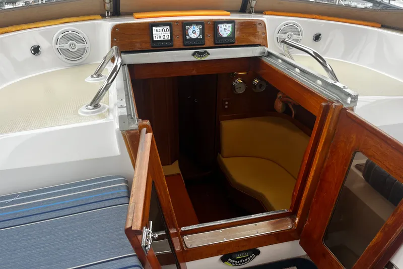 Slide: The Image of Interior view of a 1994 Hylas 49 sailboat cockpit with navigation instruments. - 56