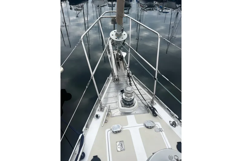 Slide: The Image of Bow of a 1994 Hylas 49 sailboat docked in a marina. - 40