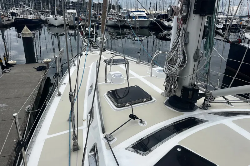 Slide: The Image of Sailboat Hylas 49, 1994 model, docked at marina with rigging and deck details. - 38