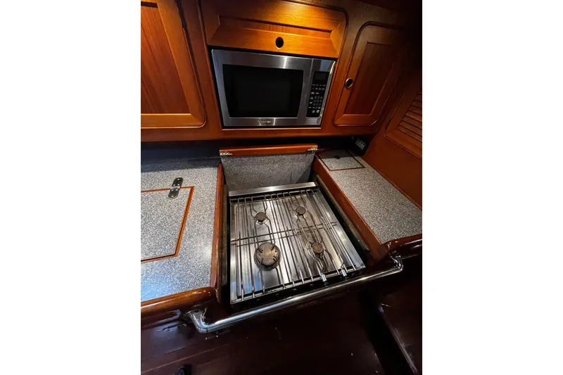 Slide: The Image of Galley kitchen in 1994 Hylas 49 yacht with stove and microwave. - 23