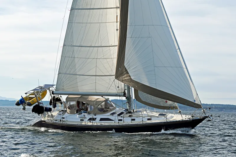 The Image of Sailing yacht Hylas 49 from 1994 gliding on open water with full sails. - 0