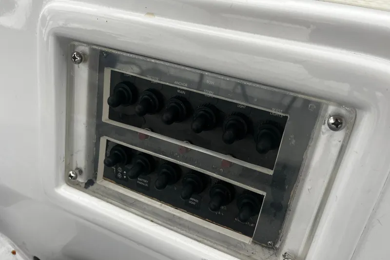 Slide: The Image of Control panel on a 1994 Hylas 49 yacht with multiple switches. - 54