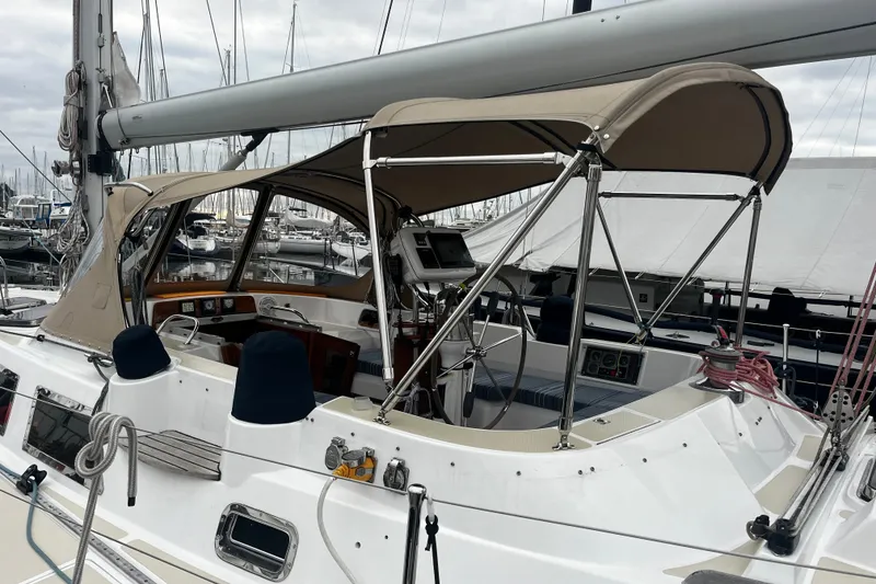 Slide: The Image of Sailboat cockpit of a 1994 Hylas 49 with canopy and navigation equipment. - 59