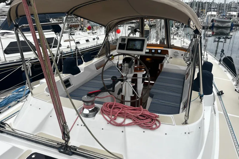 Slide: The Image of Cockpit of a 1994 Hylas 49 sailboat with navigation equipment and seating. - 50