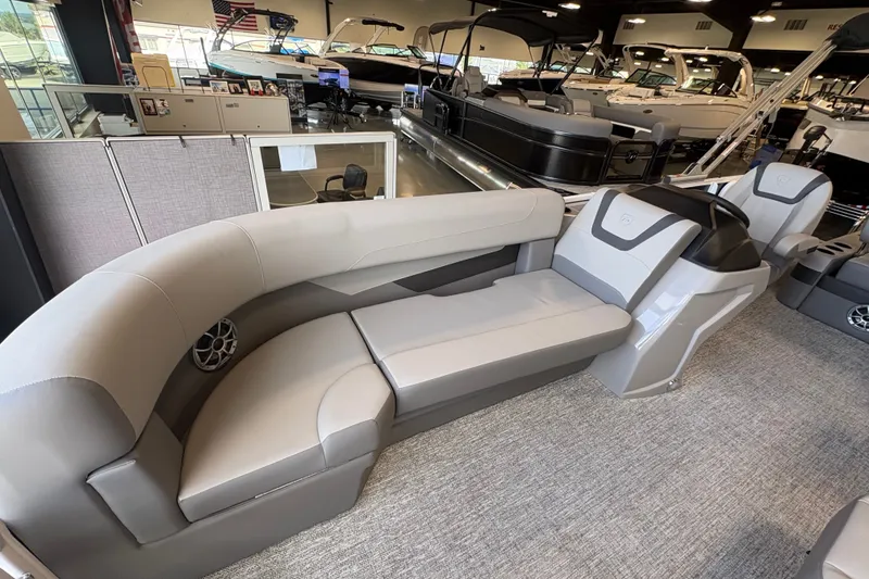 Slide: The Image of Premier 220 Sunscape RL - DL 2027 boat interior with plush seating in showroom. - 7