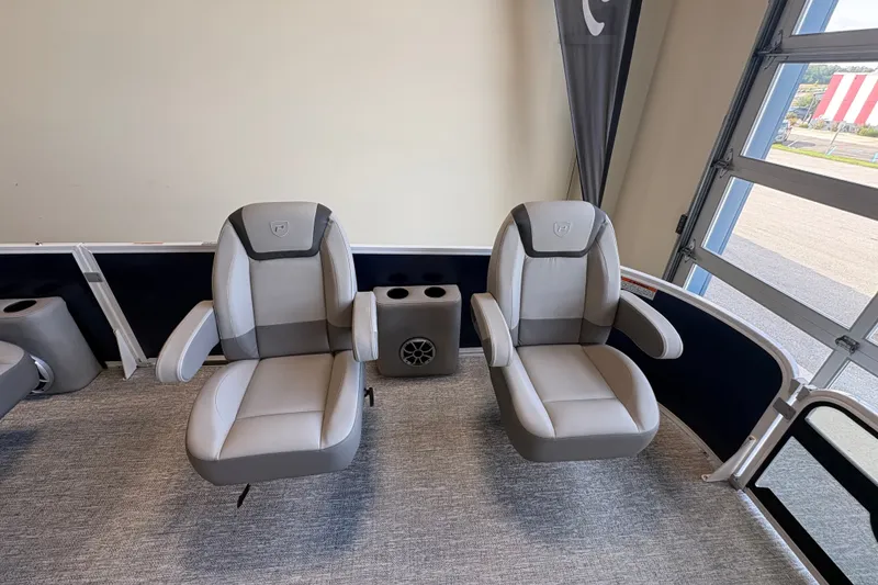 Slide: The Image of Luxury seating on 2027 Premier 220 Sunscape RL - DL boat, featuring plush gray armchairs. - 9