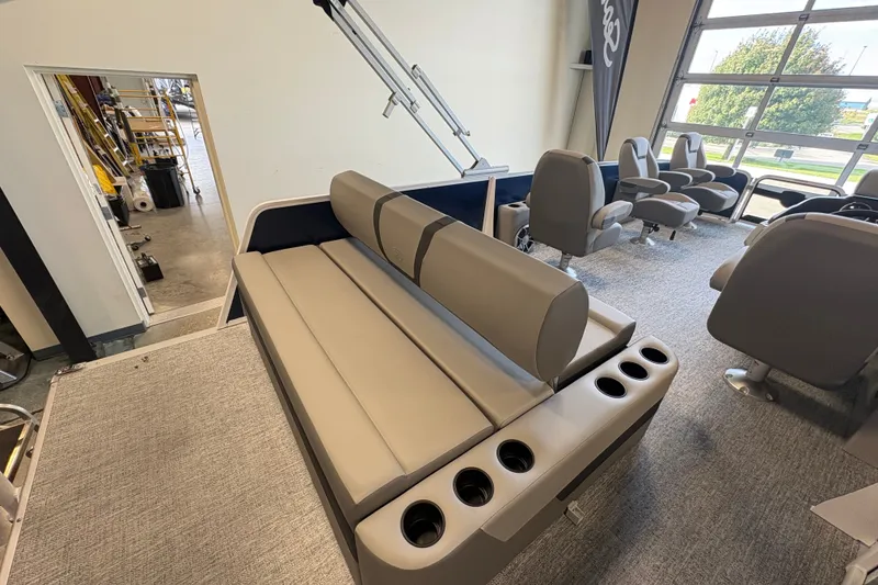 Slide: The Image of Premier 220 Sunscape RL - DL 2027 boat interior with plush seating and cup holders. - 16