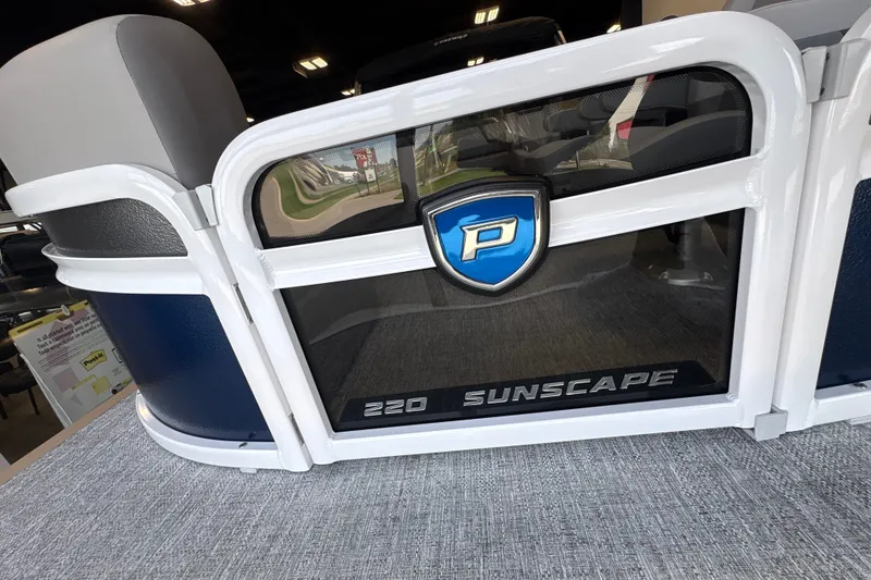 Slide: The Image of 2027 Premier 220 Sunscape RL - DL pontoon boat interior with logo and seating. - 17