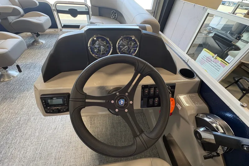 Slide: The Image of Steering console of 2027 Premier 220 Sunscape RL - DL pontoon boat, featuring modern controls. - 12