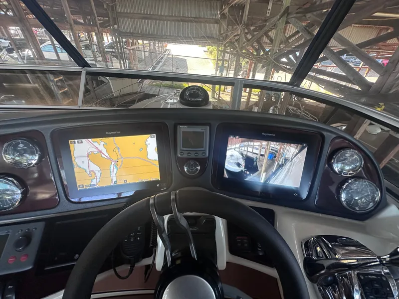 Slide: The Image of The image shows the helm of a 2009 Meridian 391 Sedan with navigation screens. - 19