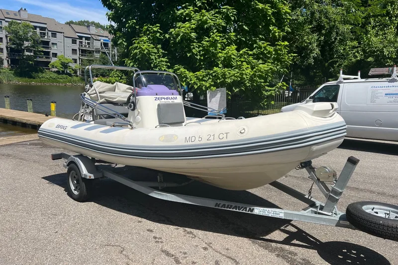 Slide: The Image of 2019 Brig Navigator 485 inflatable boat on trailer, parked near waterfront. - 16