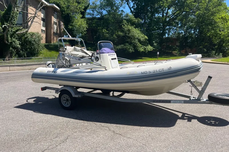 Slide: The Image of 2019 Brig Navigator 485 inflatable boat on trailer, parked outdoors. - 14